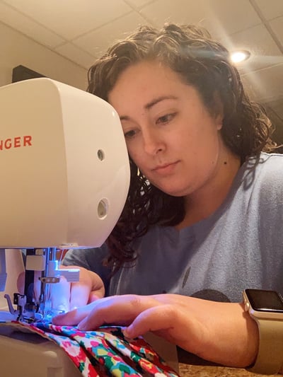 Katie sewing masks photo